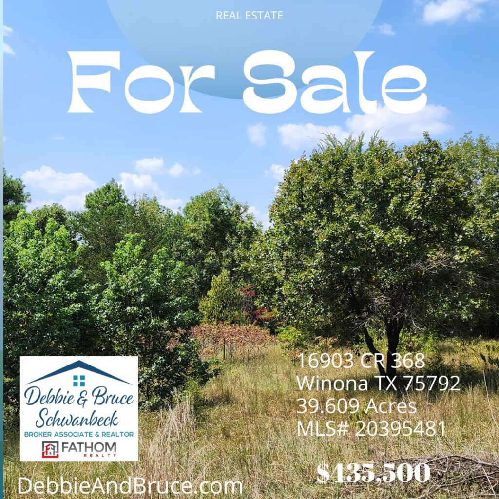 An add of for sale with trees in the background